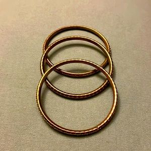 Set of three gold bracelets